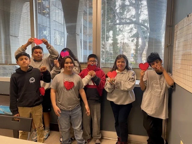 Youth in an NCADD-SFV prevention program holding paper hearts